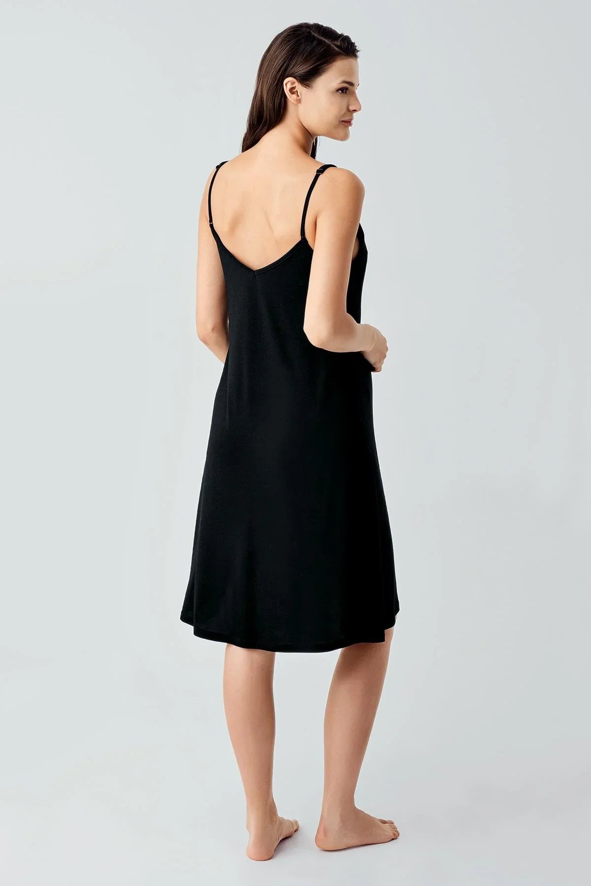 Woman wearing black short strappy maternity nightdress, Artış Collection homewear