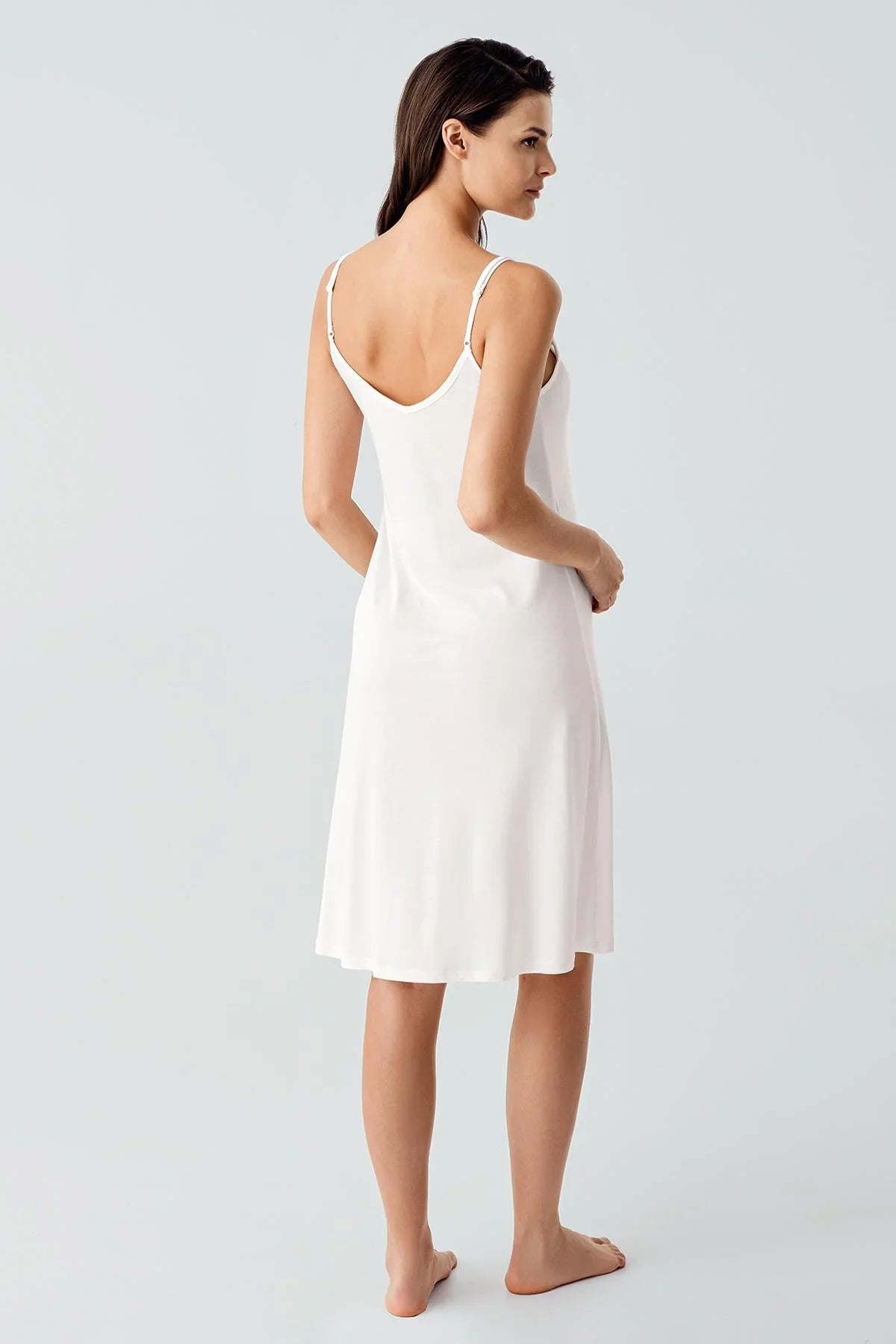 Woman wearing white sleeveless maternity nightdress with adjustable straps, Artış Collection