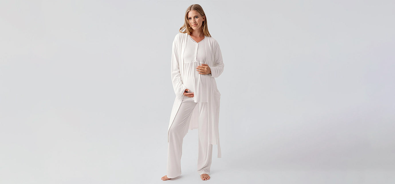 Pregnant woman in white maternity pajama set and robe, Artış Collection homewear