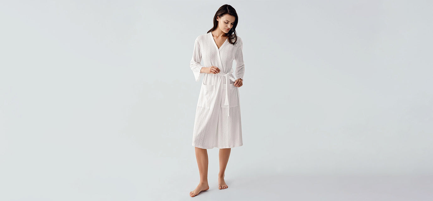 Woman wearing white robe from Artış Collection, stylish homewear with comfortable fabric
