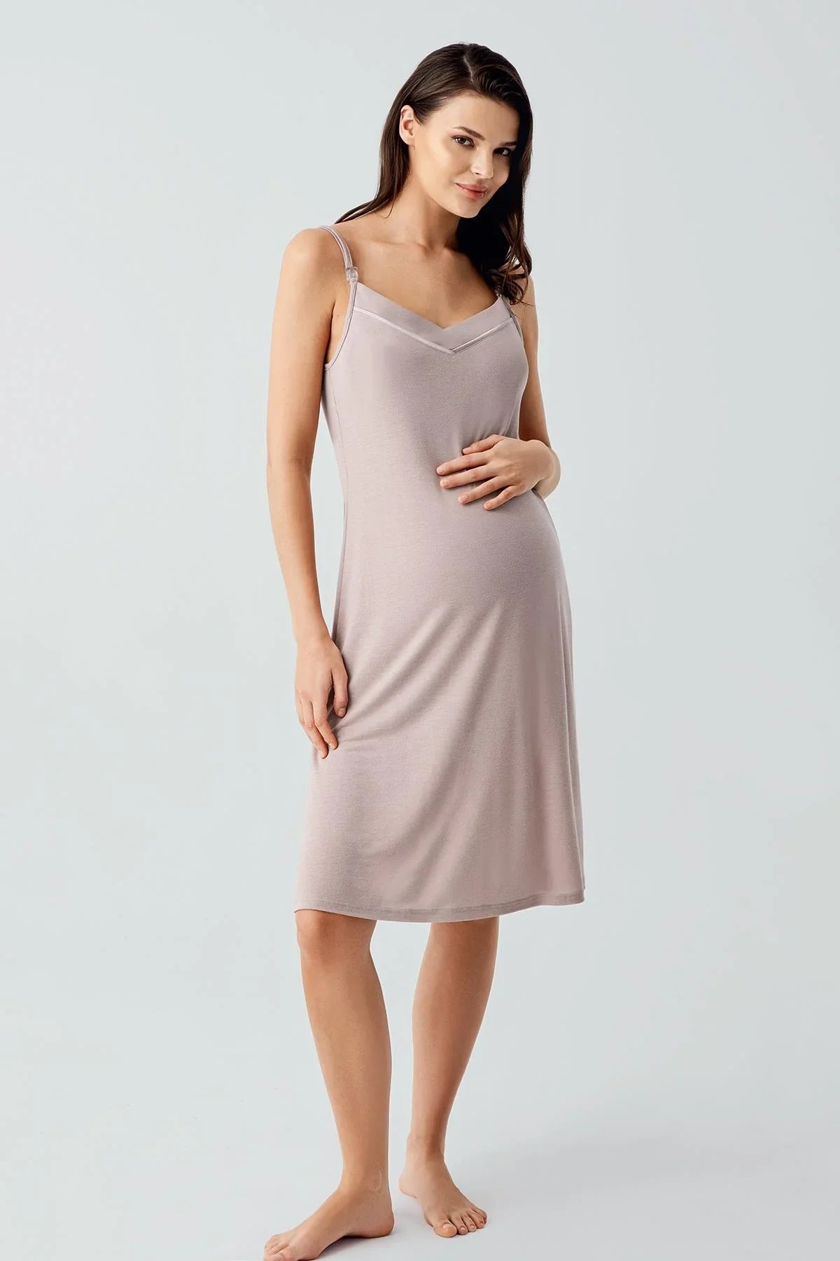 Woman wearing light pink sleeveless maternity nightgown from Artış Collection
