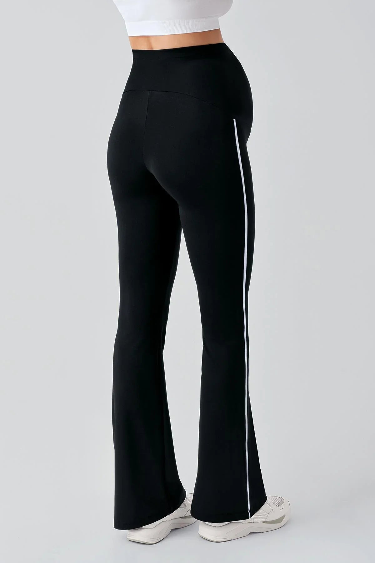 High-waist black maternity leggings with white side trim, flare leg, Artış Collection style